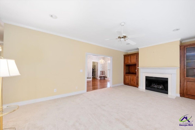 unfurnished living room with light carpet, crown molding, and ceiling fan