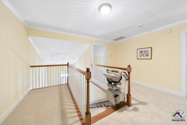 stairs featuring carpet floors and ornamental molding