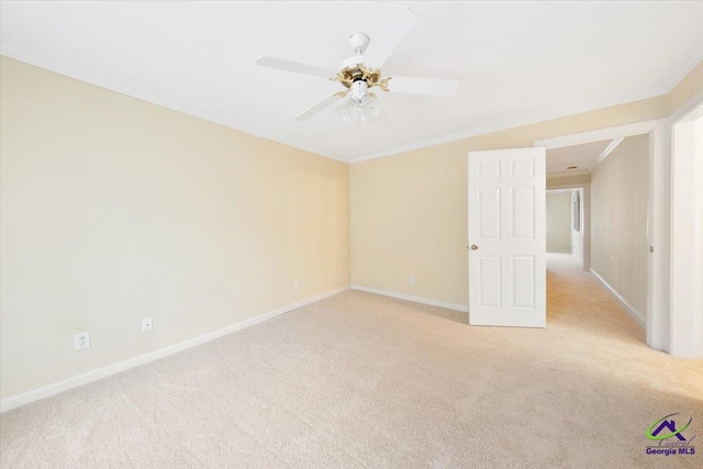 unfurnished room with light carpet, ceiling fan, and ornamental molding