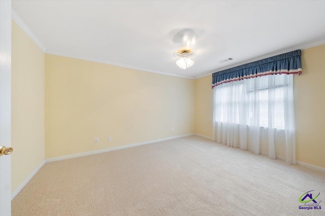 carpeted spare room with ornamental molding