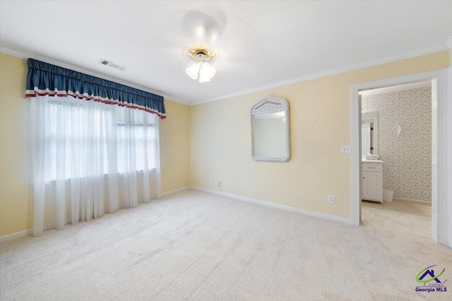 carpeted empty room featuring ornamental molding