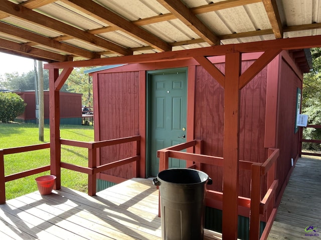 wooden deck featuring a lawn and cooling unit