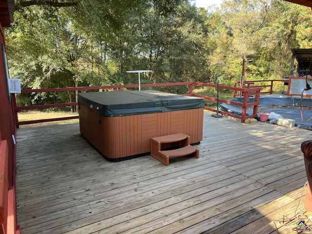 deck featuring a hot tub