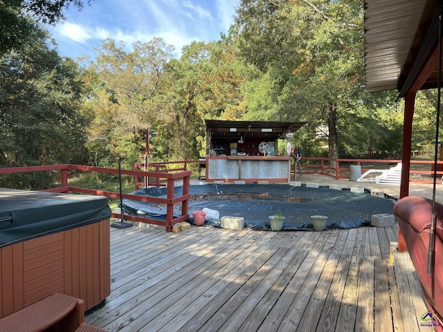 deck with a hot tub