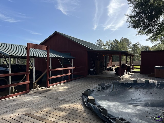 deck with a covered hot tub