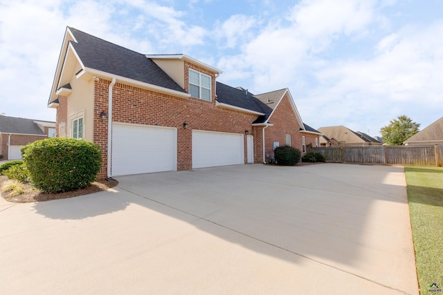 view of side of home featuring a garage