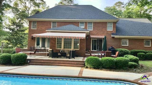 rear view of house with a patio