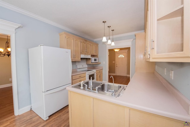 kitchen with kitchen peninsula, hanging light fixtures, light brown cabinetry, light hardwood / wood-style flooring, and white appliances