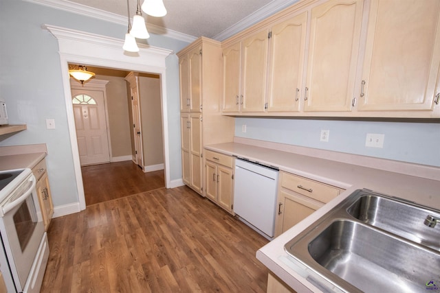 kitchen featuring crown molding, dark wood-type flooring, decorative light fixtures, and white appliances