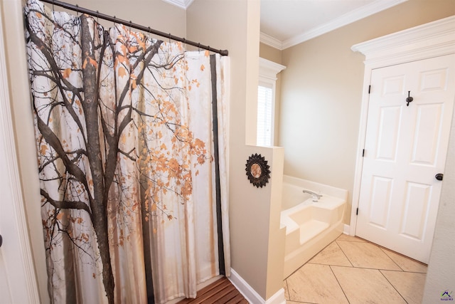 bathroom featuring a bathing tub, ornamental molding, and tile patterned floors