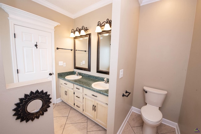 bathroom with vanity, toilet, tile patterned floors, and ornamental molding