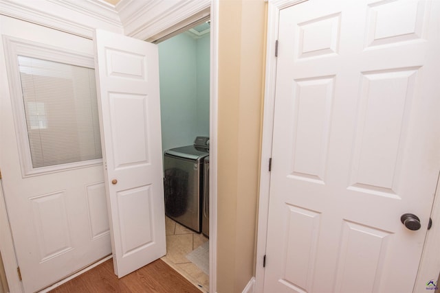 laundry room featuring wood-type flooring and washer / clothes dryer