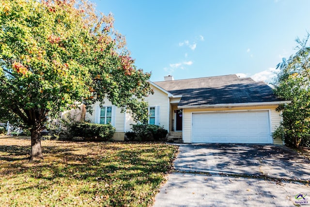 view of front facade featuring a garage and a front lawn