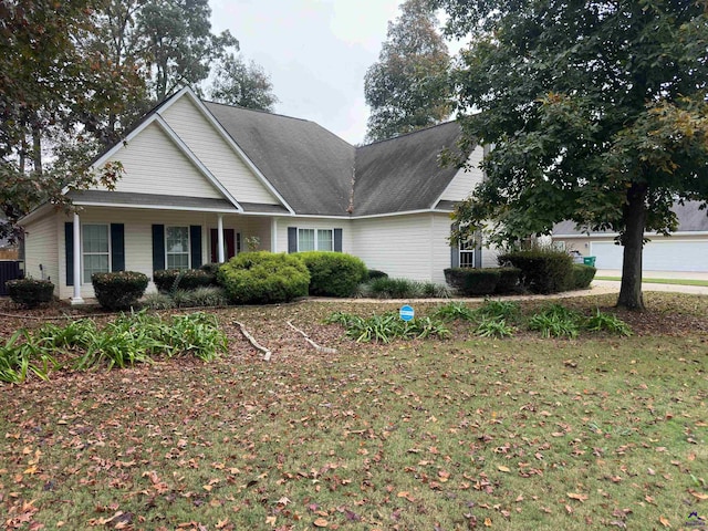 view of front of home featuring a front lawn and central AC unit