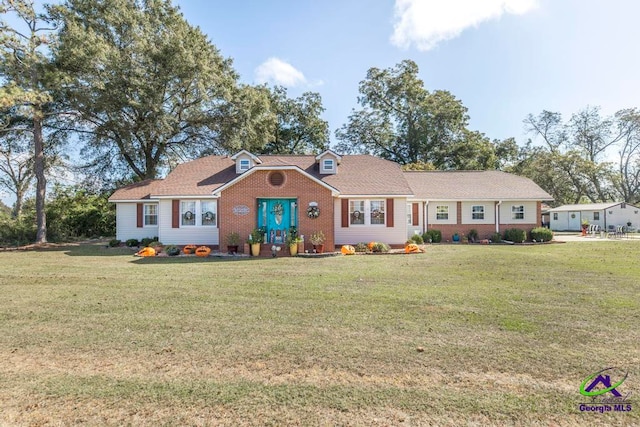 ranch-style home with a front lawn