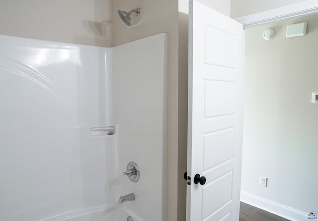 100 Saraland Trl, Perry, GA 31069 - full bath with tub / shower combination, baseboards, and wood finished floors