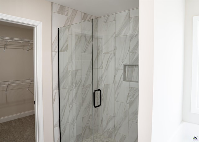 100 Saraland Trl, Perry, GA 31069 - full bathroom featuring a marble finish shower, a spacious closet, and a tub to relax in