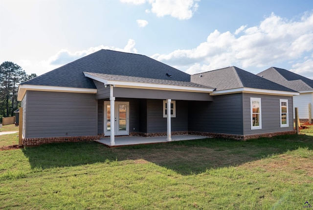 100 Saraland Trl, Perry, GA 31069 - rear view of property featuring a lawn, a patio area, and a shingled roof