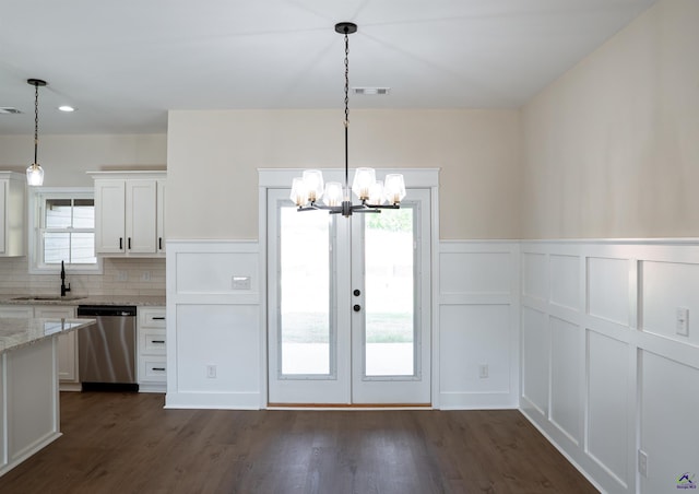 100 Saraland Trl, Perry, GA 31069 - unfurnished dining area with a sink, a chandelier, healthy amount of natural light, a decorative wall, and wainscoting