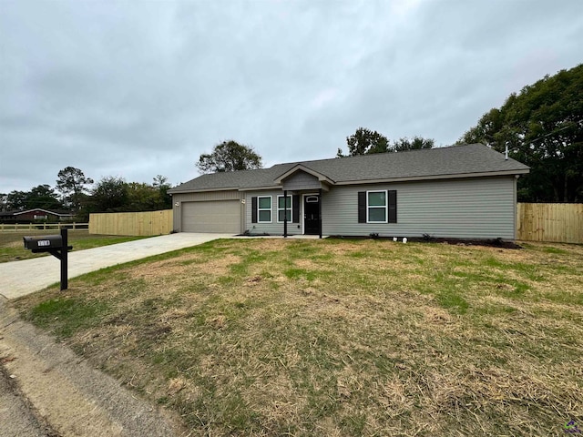 ranch-style home with a garage and a front yard