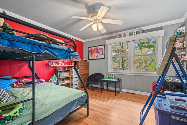 bedroom with ceiling fan, hardwood / wood-style floors, and crown molding