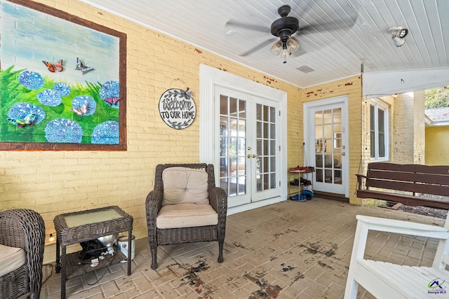 view of patio / terrace featuring ceiling fan and french doors