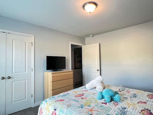 carpeted bedroom featuring a closet