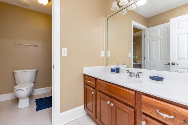 bathroom with vanity, tile patterned floors, and toilet