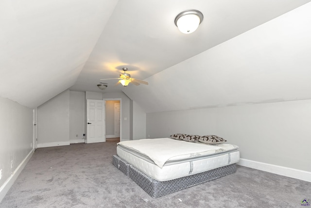 carpeted bedroom featuring lofted ceiling and ceiling fan