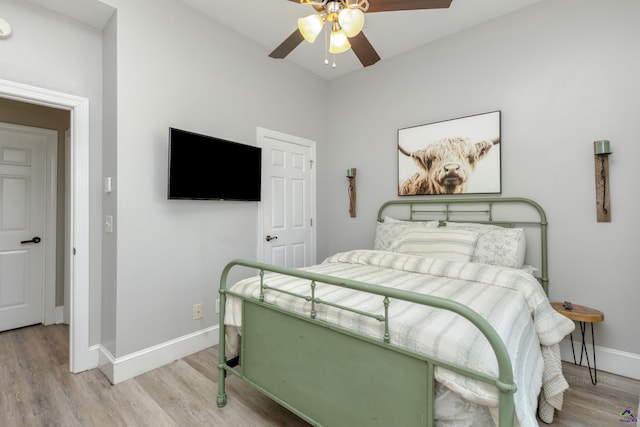 bedroom featuring light wood-type flooring and ceiling fan