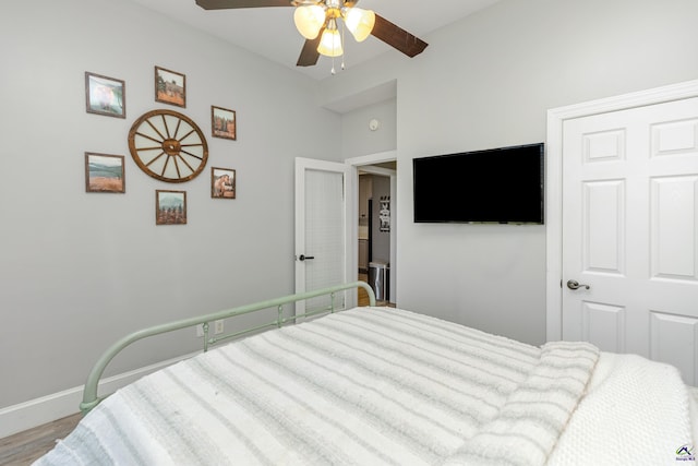 bedroom featuring hardwood / wood-style floors and ceiling fan