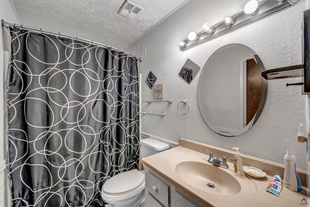 bathroom with vanity, a textured ceiling, toilet, and a shower with curtain