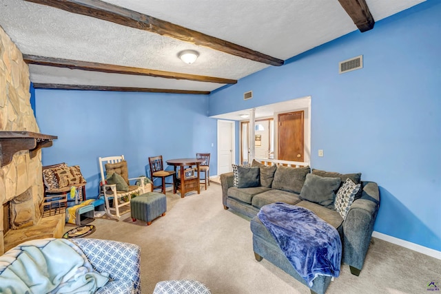 carpeted living room featuring beam ceiling and a textured ceiling