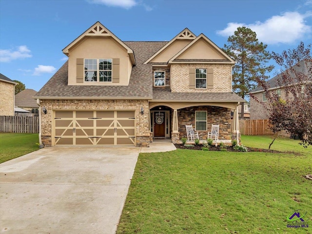 craftsman-style house featuring a front lawn and a garage