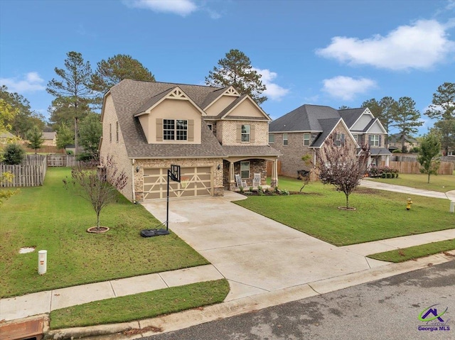 view of front of house featuring a garage and a front lawn