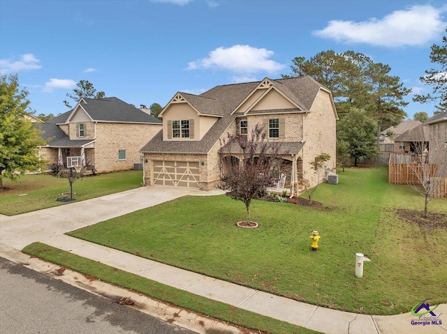 view of front facade with a garage and a front lawn