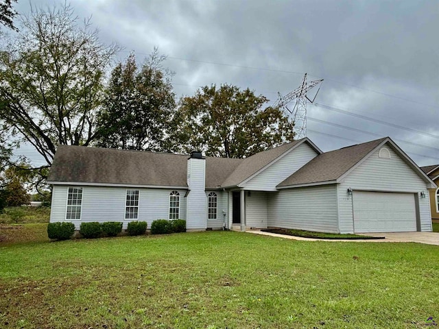 ranch-style house with a garage and a front yard