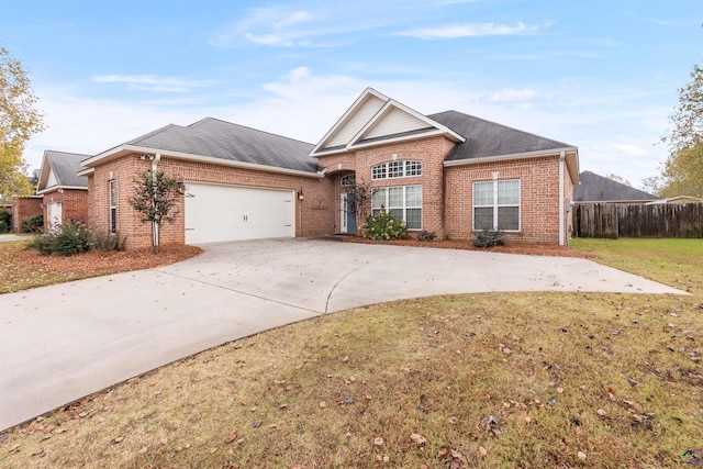 view of front facade with a garage and a front yard