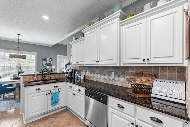 kitchen featuring dishwasher, white cabinets, sink, a textured ceiling, and kitchen peninsula