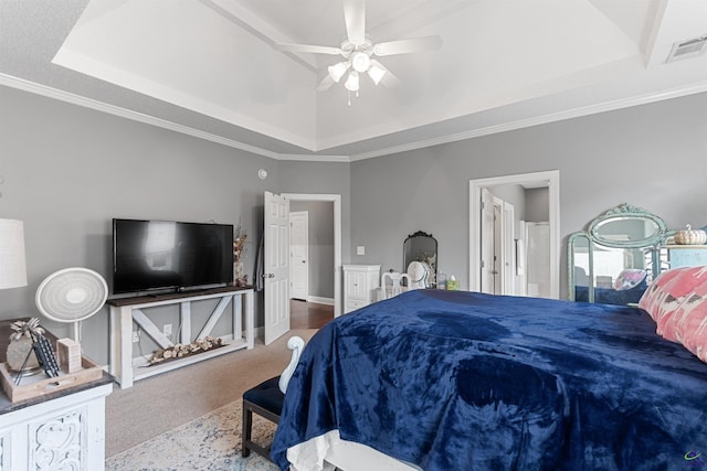 carpeted bedroom featuring a raised ceiling, ceiling fan, and crown molding