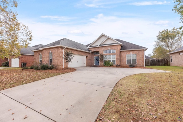 ranch-style home with a garage and a front lawn