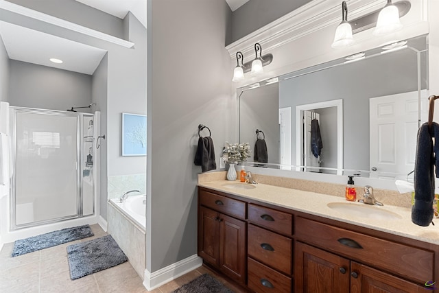 bathroom with plus walk in shower, vanity, and tile patterned flooring