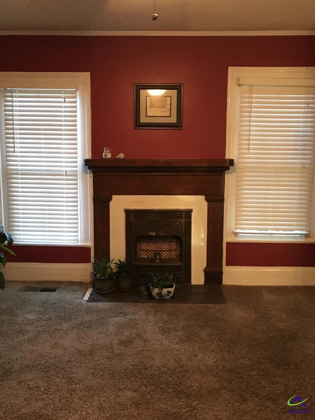 210 Anderson Ave, Fort Valley, GA 31030 - living area with a fireplace with flush hearth, carpet flooring, crown molding, and baseboards