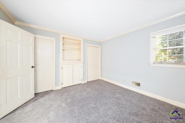 unfurnished bedroom with multiple closets, light carpet, and crown molding