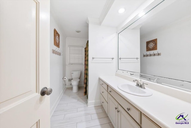 bathroom with vanity and toilet