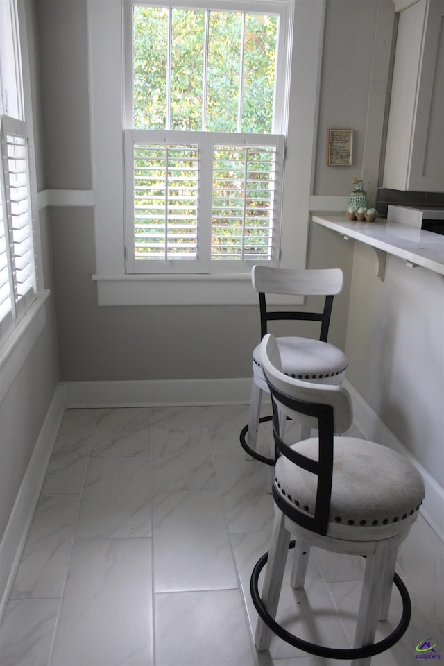 505 Engram St, Montezuma, GA 31063 - dining area with light marble finish flooring and baseboards