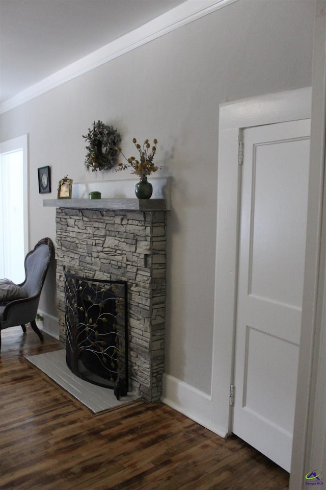 505 Engram St, Montezuma, GA 31063 - living room featuring wood finished floors, a fireplace, and crown molding