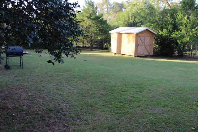 505 Engram St, Montezuma, GA 31063 - view of grassy yard featuring a storage unit