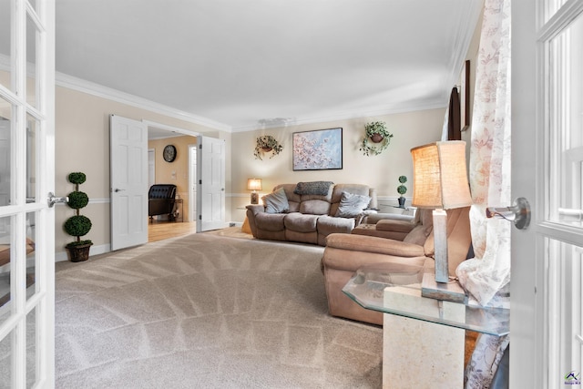 living room featuring crown molding and light carpet