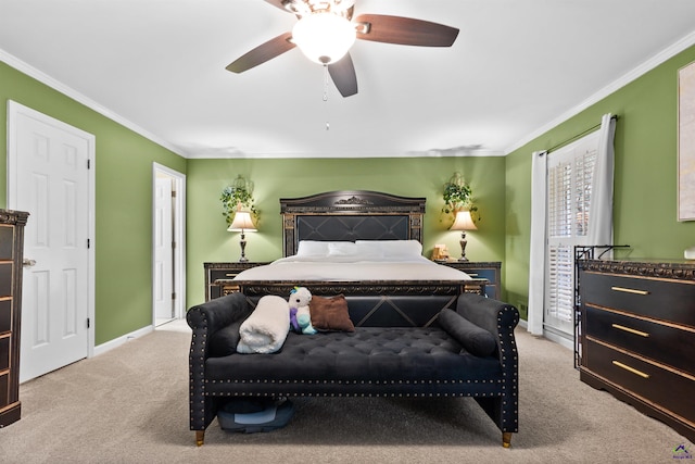 carpeted bedroom with ceiling fan and crown molding